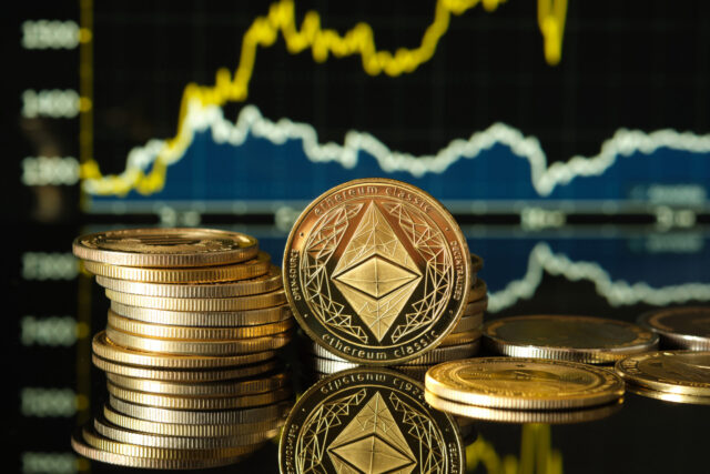 Ethereum Coins Stacked on a Reflective Surface With Digital Graphs in Background